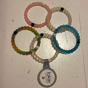 Five Lokai bracelets